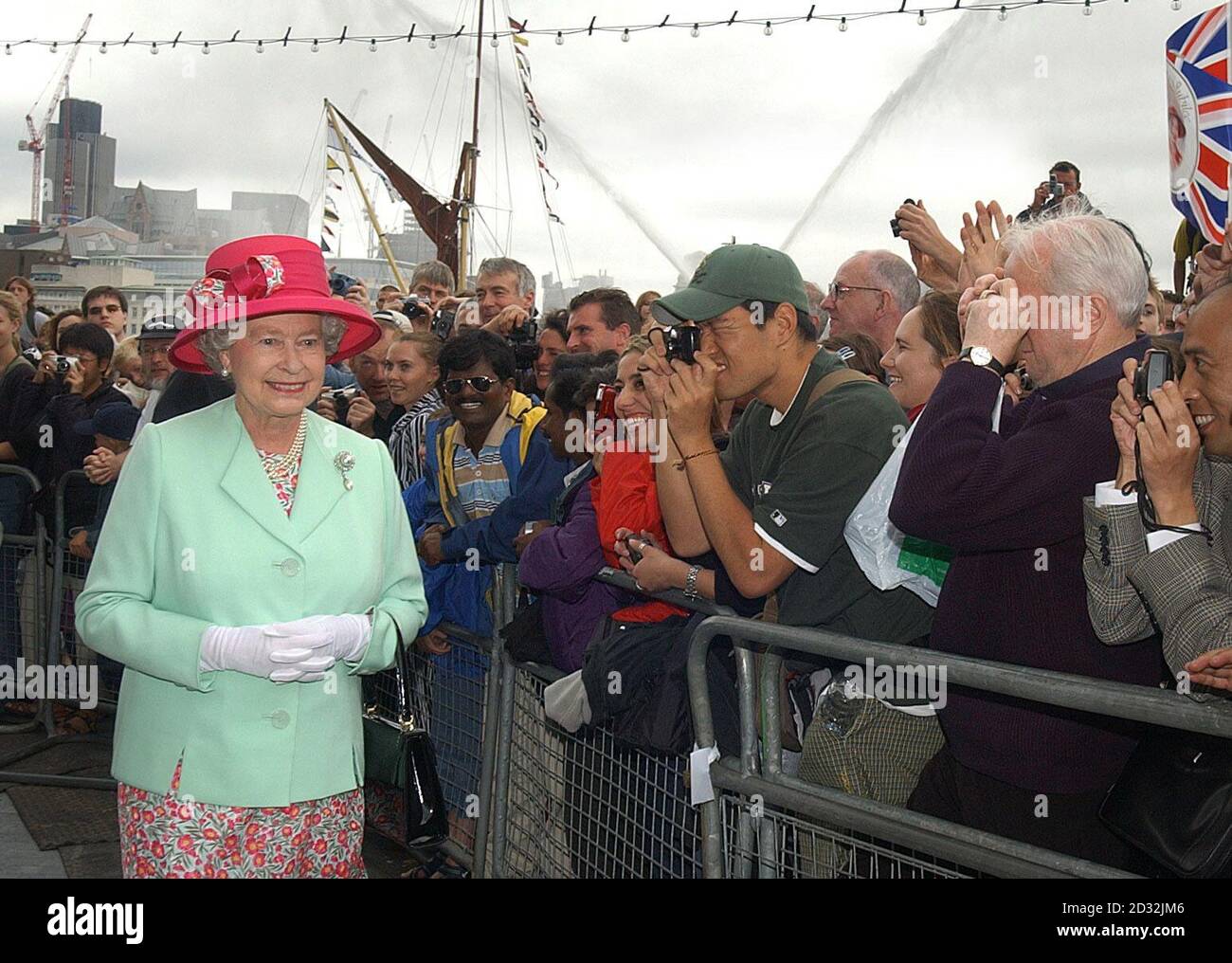 Britain's Queen Elizabeth II meets members of the public during a walkabout after opening City Hall, which houses the London Assembly, on the south bank of the Thames, close to Tower Bridge.    *The stunning building, designed by Foster and Partners, and constructed by Arup & Partners, has an assembly chamber, committee rooms and public facilities, together with offices for the Mayor, London Assembly Members and staff of the Greater London Authority. It provides 185,000 sq ft (gross) of space onten levels that can accommodate 440 staff and members. Stock Photo