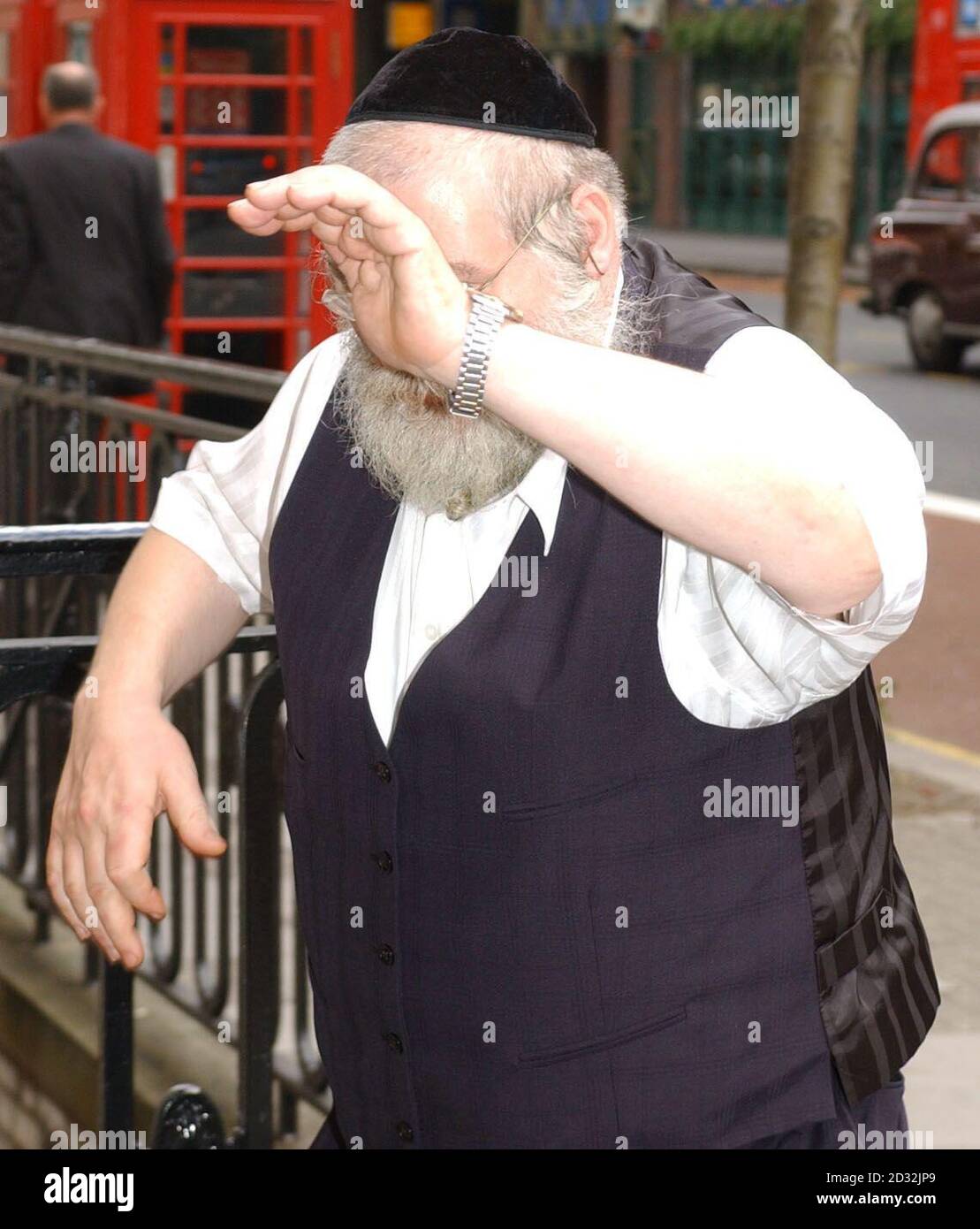 Nachman Reich, of  Reich's Caterers in Golders Green,  leaves the Employment Tribunal Court in Woburn Place, London.  An Arab Muslim was sacked from his job as a cook at a kosher caterers after  throwing food over a rabbi at a Jewish wedding.   *  an employment tribunal heard. Stock Photo