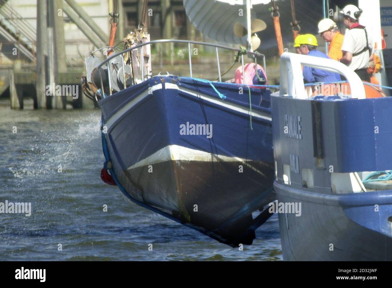 Four Colourful Local Irish Fishing Boats moored up at low tide in Fethard  Harbour in County Wexford, Southern Ireland Stock Photo - Alamy