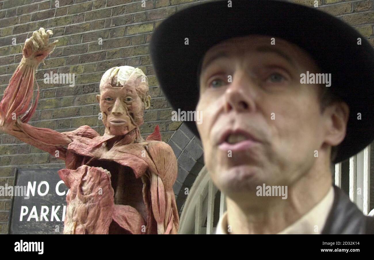 Professor Gunther Von Hagens with one of his exhibits, outside the 'Body Worlds' show where there was a demonstration at the Atlantis gallery in Brick Lane, East London. The Professor was defending his show, which uses dead bodies stripped of their skin.  *... to show the inner workings of the human anatomy. The controversial show has attracted 220,000 visitors in London alone, but has also attracted widespread criticism from protest groups. Stock Photo