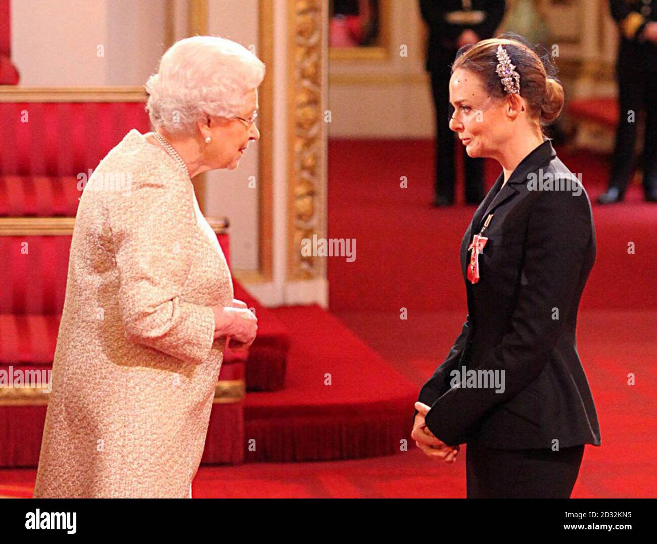 Fashion designer Stella McCartney receiving her Officer of the British Empire (OBE) medal from Queen Elizabeth II during an Investiture ceremony at Buckingham Palace in central London. Stock Photo
