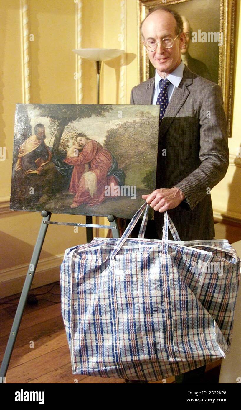 Tim Moore, General Manager of Lord Bath's Longleat Estate with the 16th century painting by Venetian artist Titian,  which was stolen from the country house seven years ago and was found in a plastic carrier bag (shown) at a photocall in central London.    * The work, Rest on the Flight into Egypt, valued at  5million, was taken from the first floor state drawing room of the Estate in Wiltshire on January 6 1995. It was recovered, without a frame but intact, in the London area in a shopping bag after a search led by former Scotland Yard detective and security adviser to the Historic Houses Ass Stock Photo