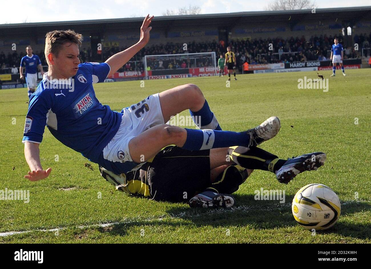 Burton's Anthony O'Connor tackles Chesterfield's Conor Townsend during the npower League Two match at the Pirelli Stadium, Burton. Stock Photo