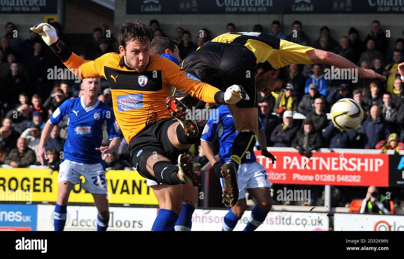 Chesterfield's goalkeeper Tommy Lee gets the wrong side of Burton's Ian Sharps during the npower League Two match at the Pirelli Stadium, Burton. Stock Photo