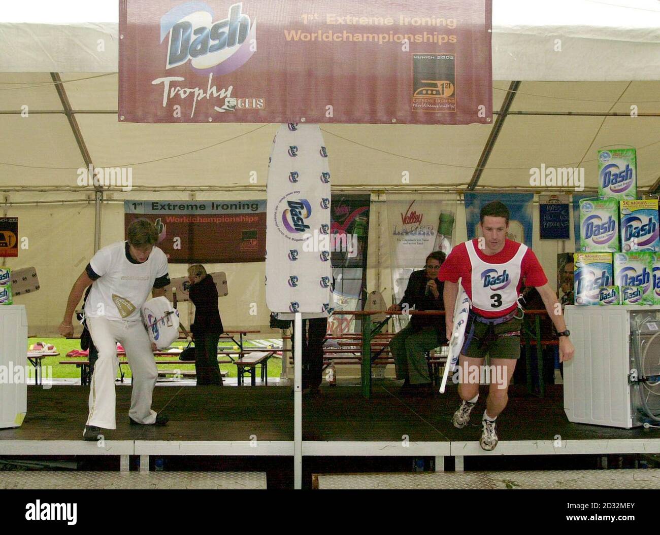 British Extreme Ironist 'Basket' (right), 24, an engineer in Leicester, takes off against a German competitor to begin the Extreme Ironing World Championships being held near Munich in Germany.   *... 'Basket' is one of 12 UK competitors, sponsored by Rowenta, in what is the first world championships to be held in the sport. Team-mate Phil 'Steam' Shaw invented the sport in 1997 when he decided to combine the mundane chore of ironing with his love of rock-climbing. The championships consist of five disciplines including urban, forest, water, free-style and rocky with around ten countries takin Stock Photo