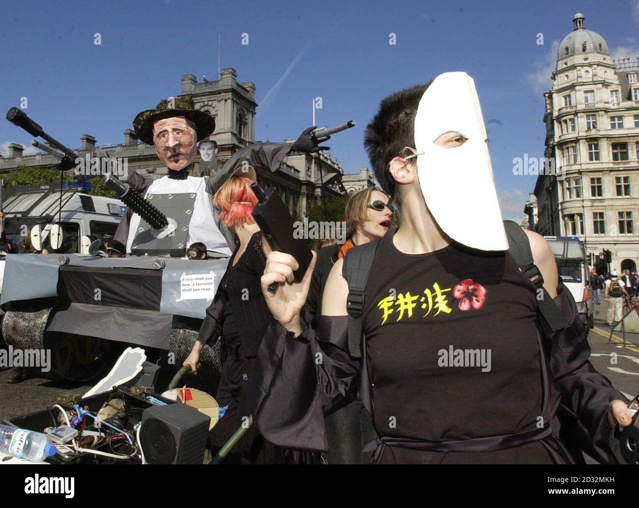 Peace activists parade a model of a tank past Westminster, in protest against the proposed war on Iraq. The protesters, formed loosely of a group of London based artists, claim the American Government is persuing a war against the Gulf state because of oil concerns. Stock Photo
