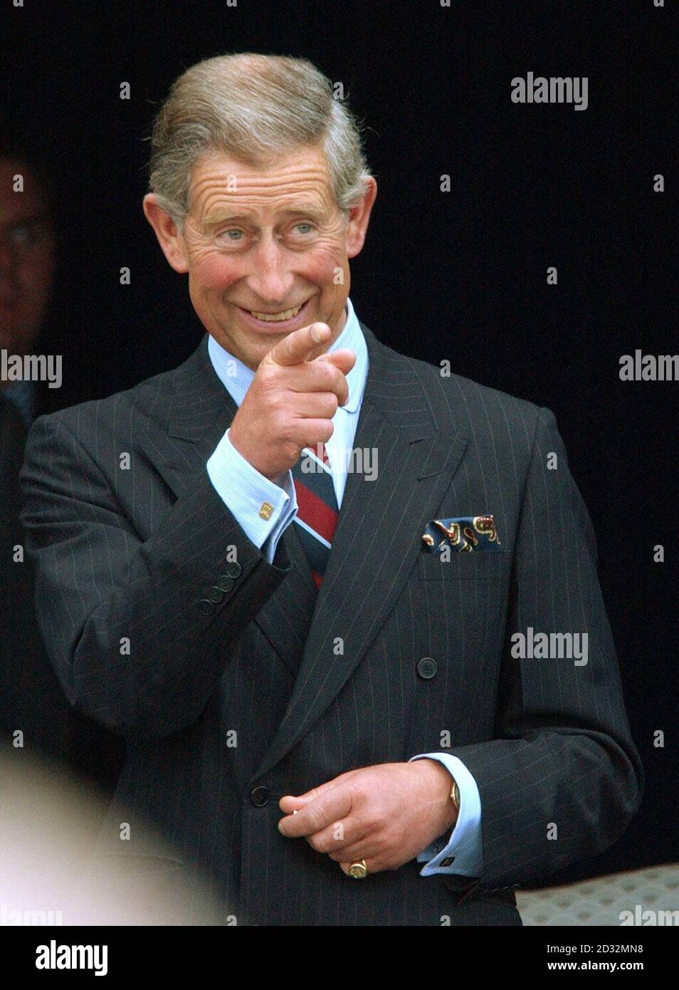 The Prince of Wales, watches a fly-past by RAF and USAF planes before the Rededication Ceremony of the American Air Museum of Great Britain at the Imperial War Museum Duxford, Cambridgeshire. Stock Photo