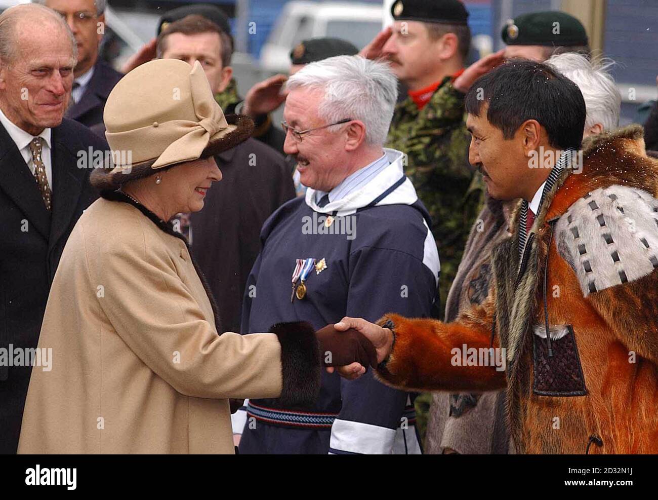 Queen Elizabeth II arrives in Iqaluit, Nunavut, Canada, greeted by Paul Okalik the Government Leader of Nunavut. Stock Photo