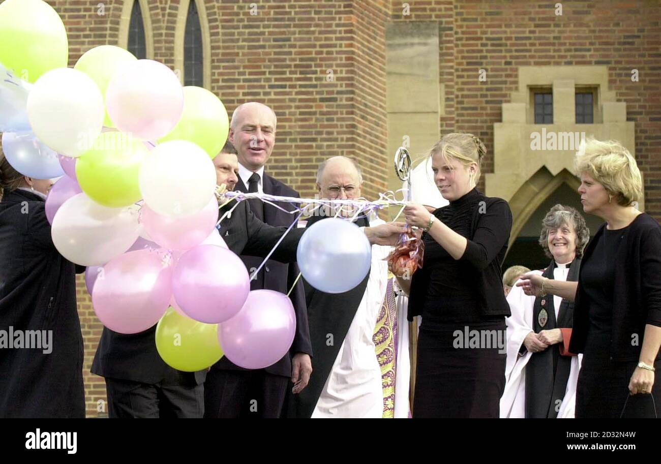 Parents of Milly Dowler, Bob (centre left) and Sally Dowler (right) watch daughter Gemma release balloons after the Memorial service, at Guildford Cathedral, Guildford, in rememberance for murdered teenager Amanda 'Milly' Dowler.   * Amanda, 13, - also known as Milly - was abducted on her way home in Walton-on-Thames, Surrey, in March. Her remains were found 25 miles away in woodland near Fleet, Hants, last month. Stock Photo