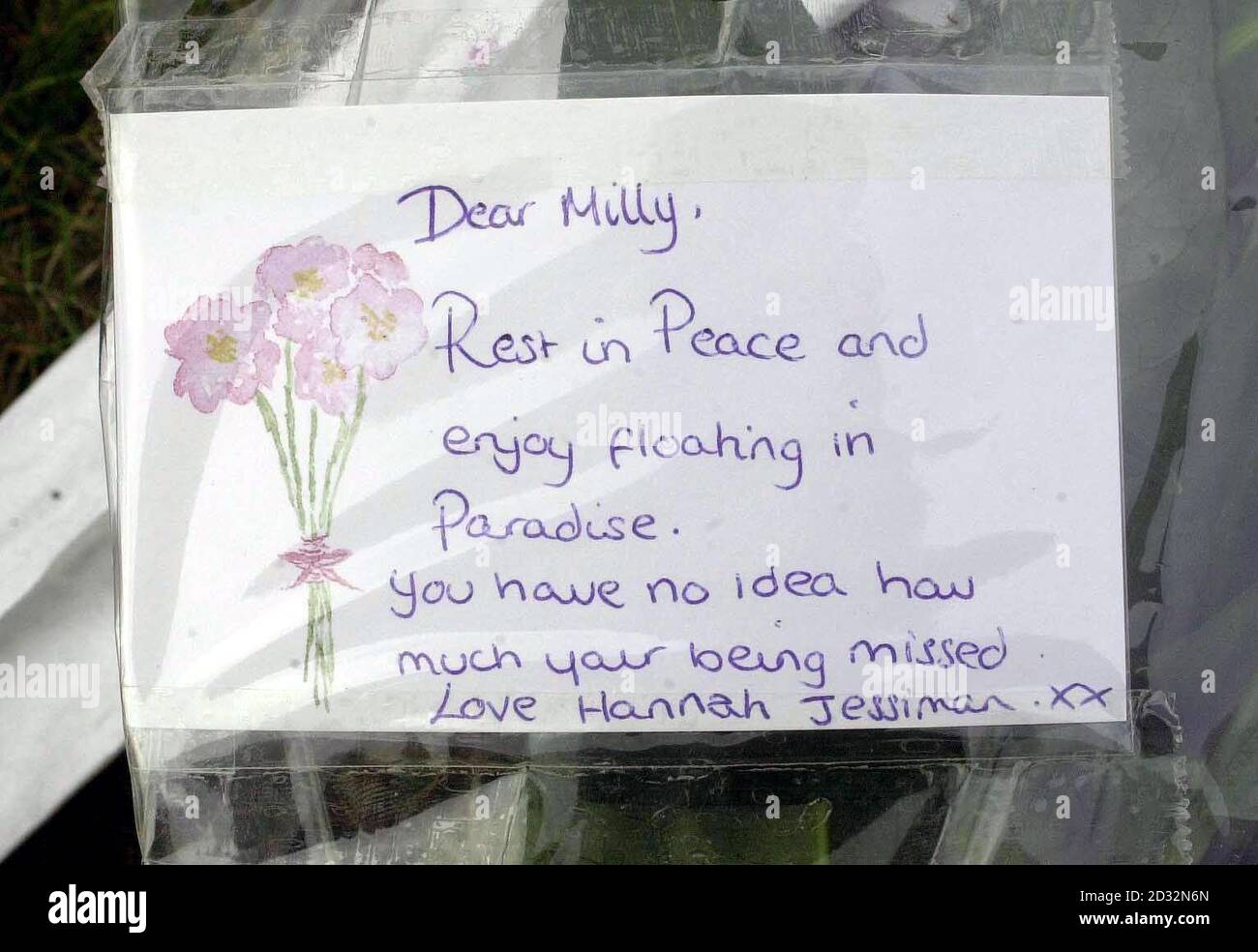 A card message left with a bunch of flowers by school friends before the Memorial service, at Guildford Cathedral, Guildford, in rememberance for murdered teenager Amanda 'Milly' Dowler. * Amanda, 13, - also known as Milly - was abducted on her way home in Walton-on-Thames, Surrey, in March. Her remains were found 25 miles away in woodland near Fleet, Hants, last month. Stock Photo