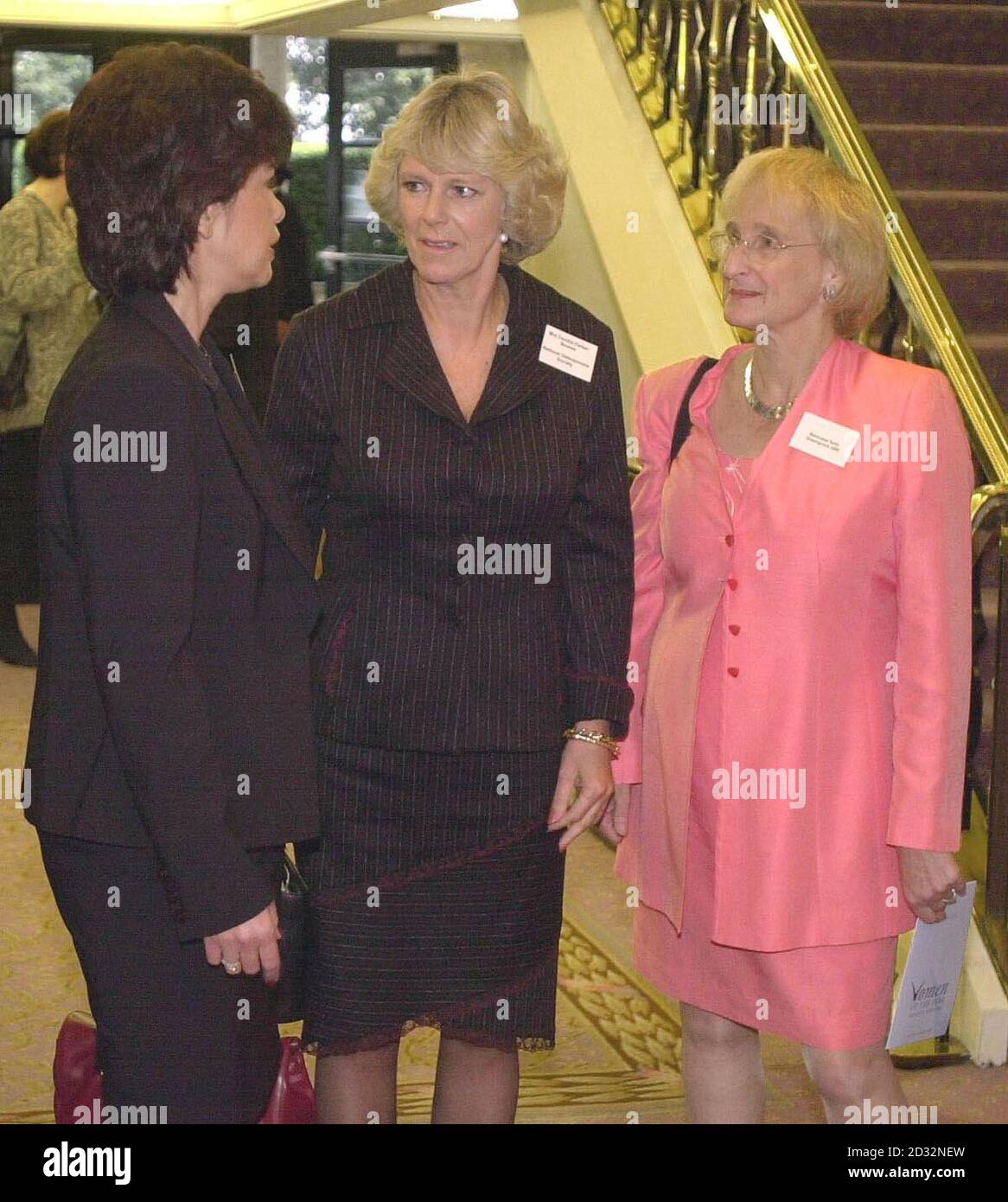 Camilla Parker-Bowles talks to Tari Hibbitt and Baroness Greengross as she arrives at the Savoy Hotel in London for the Women of the Year lunch. Record-breaking runner Paula Radcliffe was awarded the prestigious Women of the Year Outstanding Achievement Award. Stock Photo