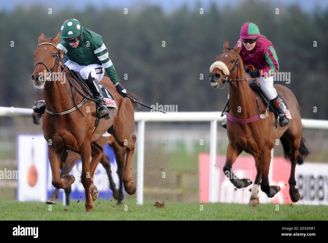 Rockyaboya ridden by jockey Pat Mullins (left) on their way to victory in the Diageo Ireland Punchestown Charity Race during the AES Festival Family Day of the 2013 Festival at Punchestown Racecourse, Co Kildare, Ireland. Stock Photo