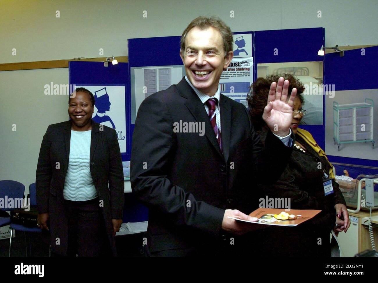 Prime Minister Tony Blair waves goodbye to a group of midwives after addressing an international conference entitled 'Birth Rights : Liberty Through Legislation?' at the Queen Elizabeth II Conference Centre in central London.  * ... aimed at celebrating 100 years of professional midwifery. The conference began today and will continue until Wednesday.  Stock Photo