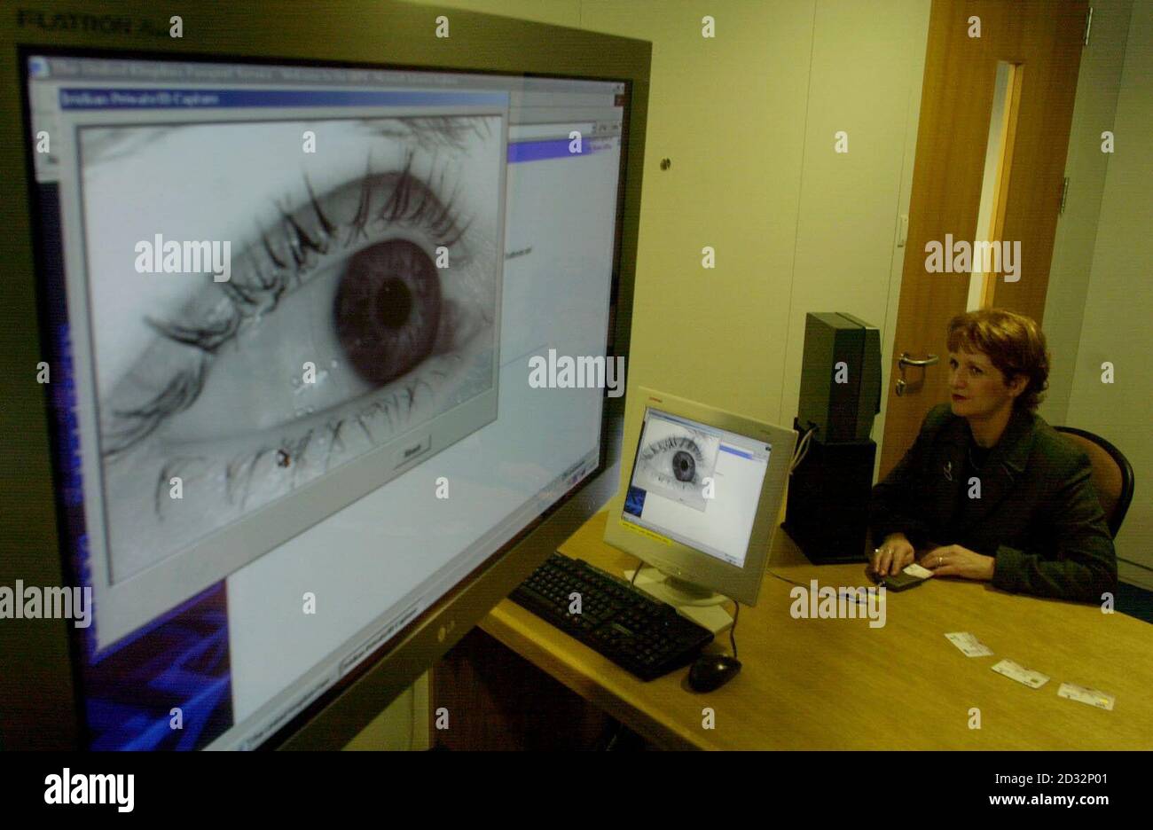 Home Office minister Beverley Hughes has a pre-recorded digital image of her iris (the coloured ring around the eye) authenticated as part of a demonstration of how biometric identification works, at the United Kingdom (UK) Passport Office in central London. * The minister was visiting the biometrics demonstrator as the government consults on whether it should introduce entitlement cards as a means of countering the increase in identity fraud. The recording of biometric data, such as the iris could, as a governmental consultation paper on entitlement cards suggests, build on existing ident Stock Photo