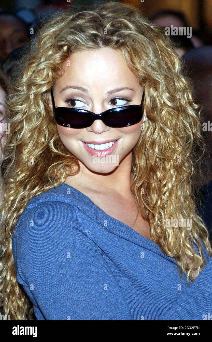 US singer Mariah Carey poses for the media outside the Mandarin