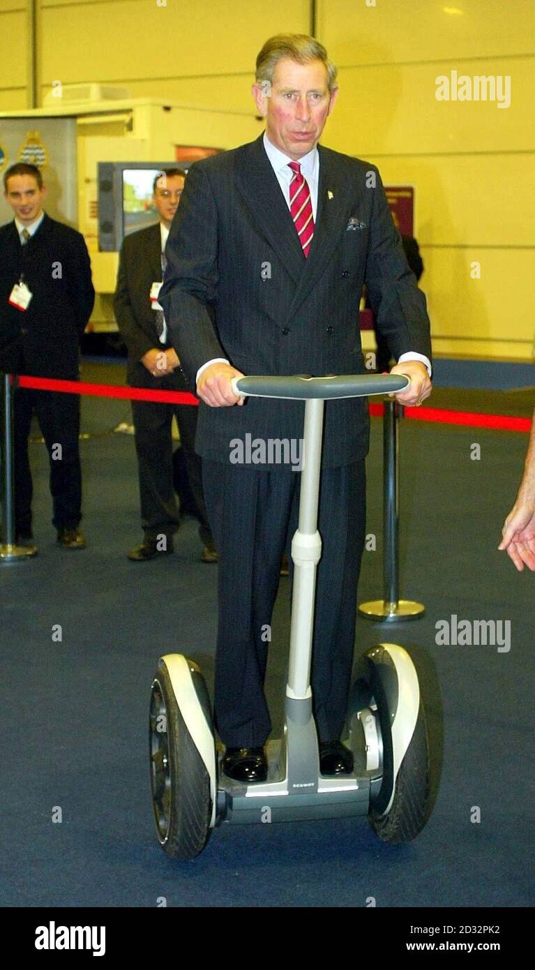 The Prince of Wales, on his 54th birthday, rides on an electrically-powered Segway during a visit to a vocational careers' fair in Salford, Greater Manchester. *...The invention, which looks like an electric scooter, uses a high-tech system of gyroscopes to detect the user's natural sense of balance to steer it. The electrically powered Segway was developed with the help of British firm BAE Systems in an attempt to make getting around urban areas quicker and easier. The invention was being showcased at SkillCity, a joint venture between the Prince's Trust and charity UK Skills aiming to e Stock Photo