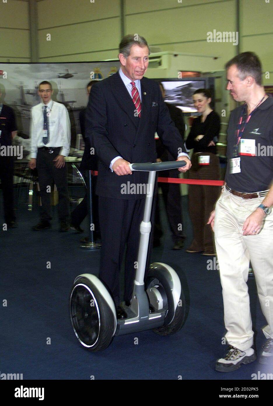 The Prince of Wales, on his 54th birthday, rides on an electrically-powered Segway during a visit to a vocational careers' fair in Salford, Greater Manchester. *..The invention, which looks like an electric scooter, uses a high-tech system of gyroscopes to detect the user's natural sense of balance to steer it. The electrically powered Segway was developed with the help of British firm BAE Systems in an attempt to make getting around urban areas quicker and easier. The invention was being showcased at SkillCity, a joint venture between the Prince's Trust and charity UK Skills aiming to enthu Stock Photo