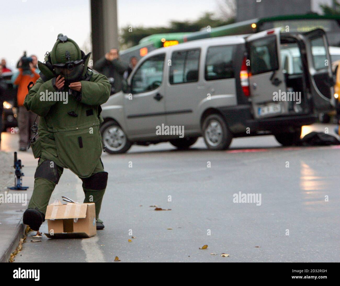 A Turkish policeman from the bomb squad approaches a suspect package on the  street some 500 meters from the St. Esprit church in Istanbul November 29,  2006. Pope Benedict, pursuing a journey