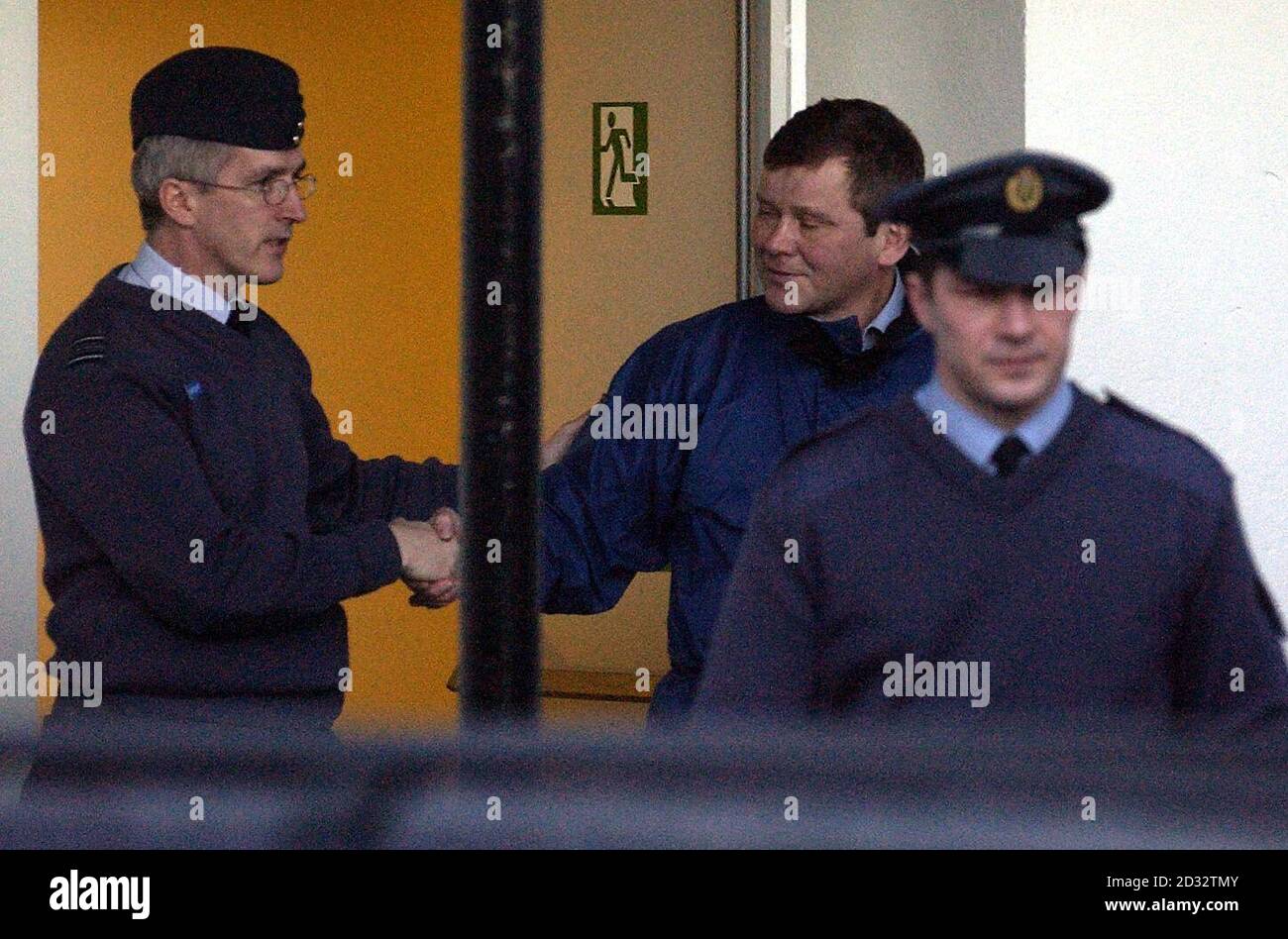 RAF air traffic controller Flight Lieutenant Malcolm John Williams (right) shakes the hand of Squadron Leader John Stembridge-King as he leaves a court-martial in Helensburgh, where he was charged with causing the death of two pilots in a doubt jet crash.  *   Williams faces an alternative charge of negligently performing in his duties as an air traffic controller but has pled not guilty to all charges. Stock Photo