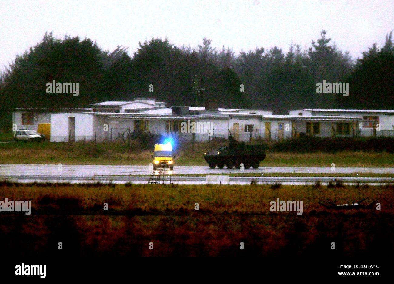 An armoured personnel carrier patrols the runway of Shannon airport in Co. Clare, Ireland, after recent attacks by peace protesters on US planes refuelling at the airport.    *..Some 120 soldiers have moved in to provide 24-hour security at the airport after a US navy plane was vandalised twice while refuelling on its way to the Gulf region. Peace protesters have opposed the use of the airport by aircraft carrying US troops to the Gulf.   Stock Photo