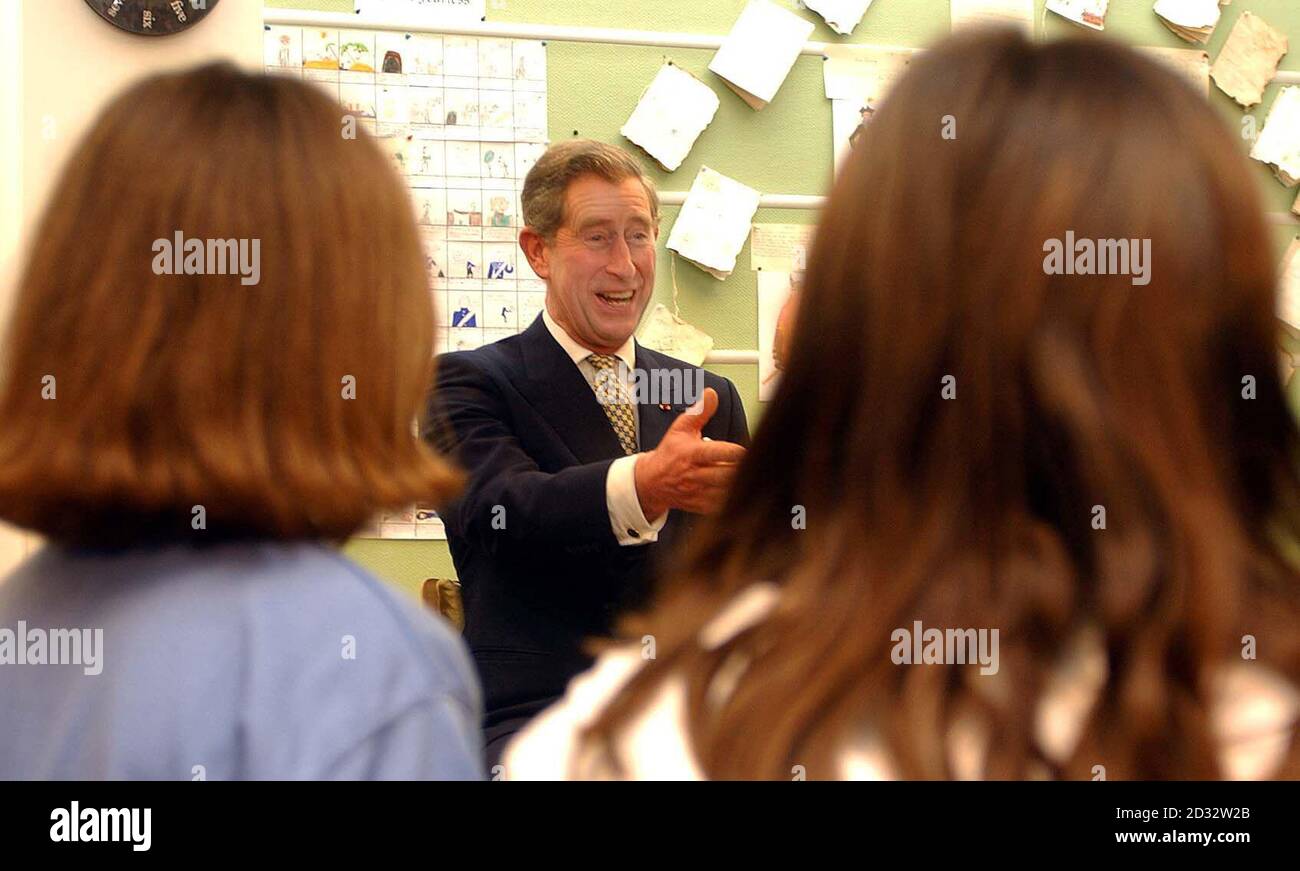 The Prince of Wales chats with French school children during a visit to the British Council building in Paris. The Prince was spending the day in the French capital helping promote sales of British beef, visiting the Sorbonne and attending a concert in the evening. Stock Photo