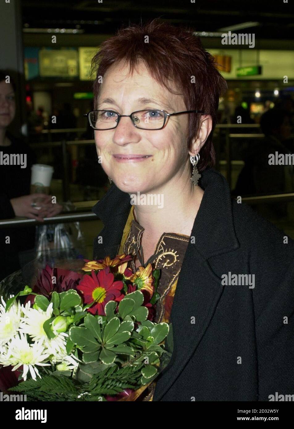 Lesley McCulloch, 40, from Dunoon in Argyll, at Heathrow. She was released on Sunday after being convicted of visa violations by a court in Banda Aceh on December 30, along with US nurse Joy Saddler. The pair, who were arrested on suspicion of spying, *..had already spent more than three months on remand when they were convicted of the lesser charge and ordered to serve out the remainder of their sentences. * 16/02/2003: Lesley McCulloch whose family was Sunday February 16 2003, ready to receive her at the airport where they watched her begin a journey that ended with her arrest over spyin Stock Photo