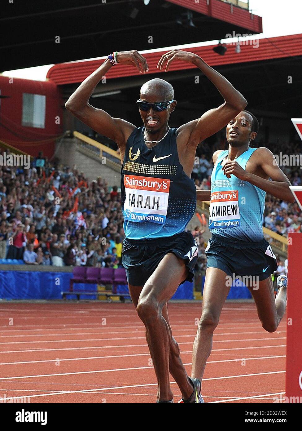 Great Britain's Mo Farah celebrates with the Mobot as he wins the Men's 5000m race during day two of the Birmingham Diamond League athletics meeting at the Birmingham Alexander Stadium, Birmingham. Stock Photo