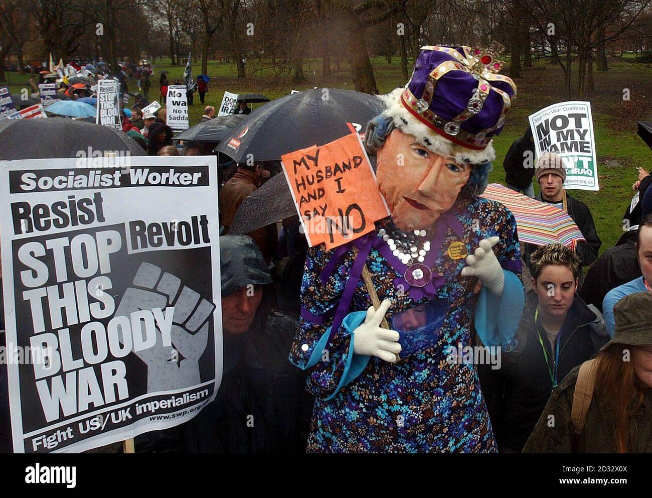 A demonstrator dressed as Britain's Queen Elizabeth II joins thousands of anti war protesters at a march in Manchester. Stock Photo