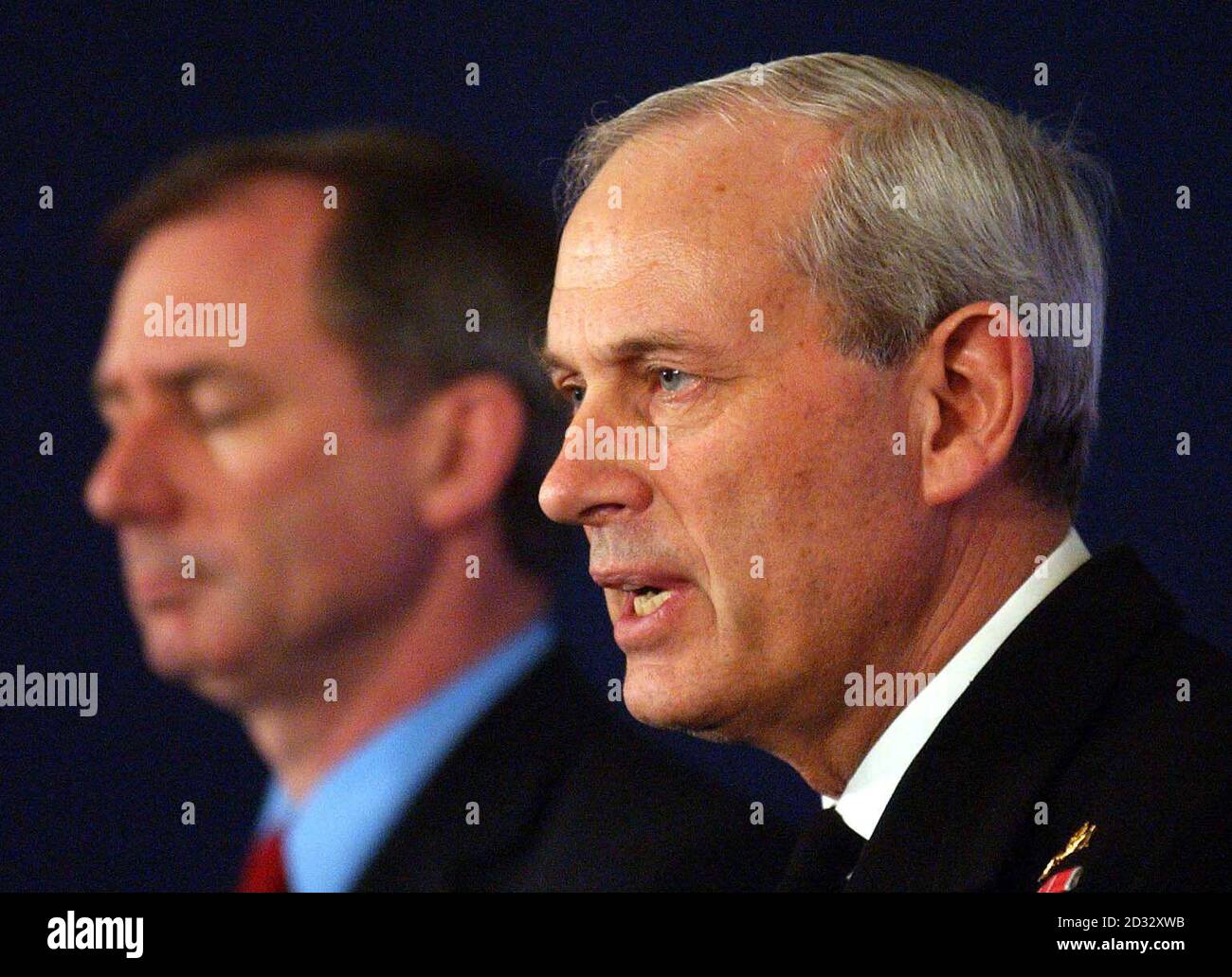 Geoff Hoon (left) the Minister of Defence with Admiral Sir Michael Boyce the Chief of the Defence staff, talking about the first British casualties suffered in the Iraq war, at a press briefing in central London. Coalition forces are on the outskirts of Iraq s second largest city Basra, *..the UK's Chief of Defence Staff Admiral Sir Michael Boyce said. Addressing the first of regular Ministry of Defence briefings on the progress of the war, Sir Michael gave details of British commandos' capture of the Al Faw peninsula and its vital oil infrastructure, as well as the American seizure of the Stock Photo
