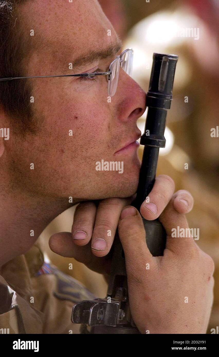 A Household Cavalry Regiment soldier, during a regiment briefing in southern Iraq,  lost in his thoughts for fallen comrade Medic Lance Sgt. Colin Whitley. Stock Photo