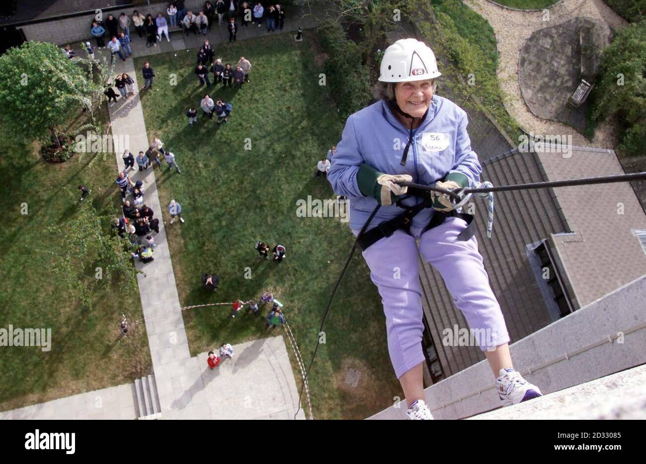88-year-old Rosina Burson from Abbey Wood, south London, abseils from St Nicholas house at the Queen Elizabeth hospital in Woolwich, south London to raise money for Macmillan cancer relief.  Stock Photo