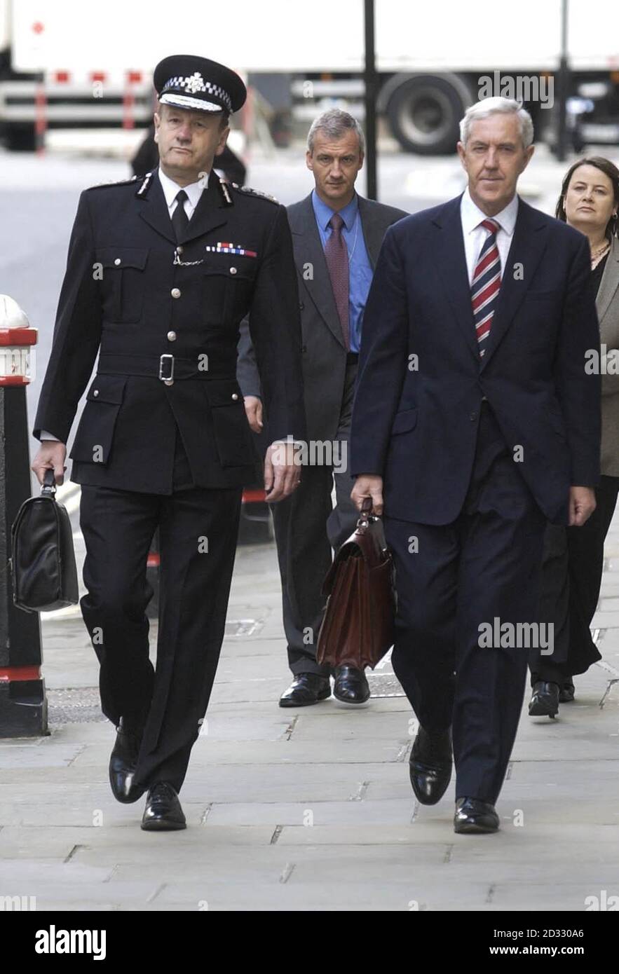 Metropolitan Police Commissioner Sir John Stevens (left) and his predecessor Lord Condon arriving at the Old Bailey in London, where they are due to stand trial accused of safety breaches relating to police officers. * They have both pleaded not guilty to five charges brought by the Health and Safety Executive. The prosecution centres on the assessment and management of the risk faced by police officers of falling from or through roofs while assisting in the apprehension of suspects. 26/04/04: Sir John Stevens is retracing the final route of Diana, Princess of Wales. He plans to see for Stock Photo