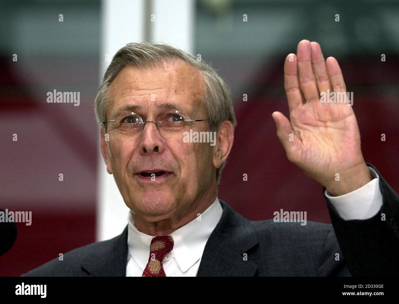 U.S. Defense Secretary Donald Rumsfeld speaks at a news conference with Britain's Secretary of State for Defence Geoff Hoon (not in picture) at London's Heathrow Airport.  Mr Rumsfeld was in Britain for talks with Prime Minister Tony Blair.  * .. during the last stop on a trip that has taken him to the Persian Gulf and Afghanistan.  07/05/04: US defence secretary Donald Rumsfeld, who has faced growing demands to resign over the abuse by of Iraqi prisoners by US soldiers. But President George Bush has said: 'He'll stay in my Cabinet'. Stock Photo