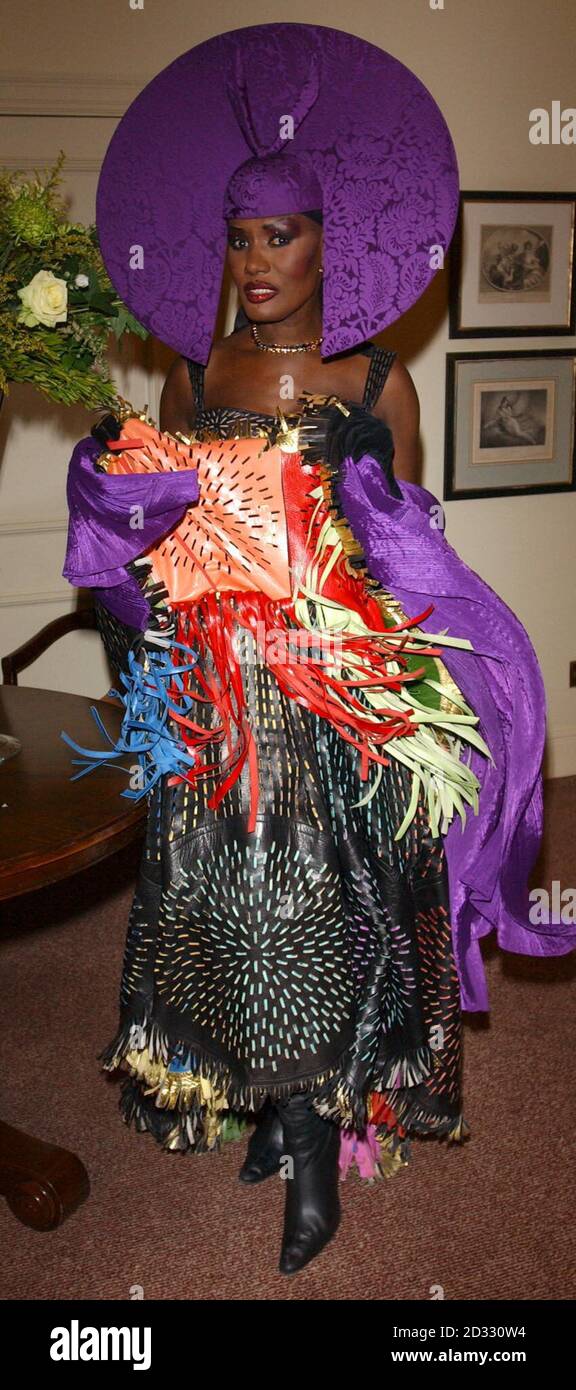 grace jones purple dress Grace Jones arrives for the Sony Radio Awards 2003 at Le Meridien,  Grosvenor House Hotel in London Stock Photo