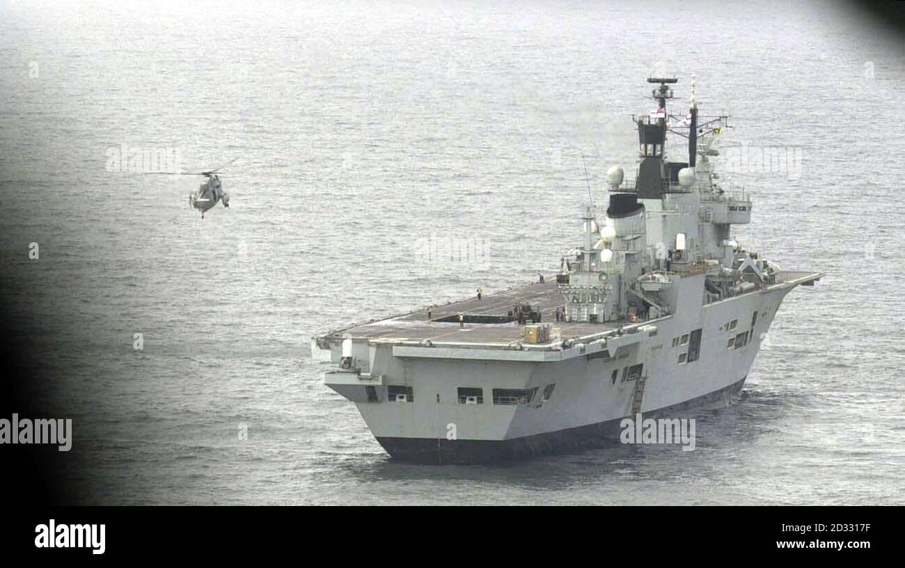 HMS Ark Royal in Mounts Bay, Cornwall. About 300 personnel from three helicopter squadrons flew off the warship to be reunited with loved-ones at RNAS Culdrose, their base at Helston, Cornwall.   *... Among the returning crew were members of 849 A Flight, Airborne Surveillance and Control, which lost seven aircrew when two Sea King helicopters collided in mid-air in the Gulf. Personnel from 814 squadron and 820 squadron also left the carrier. The carrier is en-route back to Portsmouth Naval Base, where she is due to arrive. Stock Photo