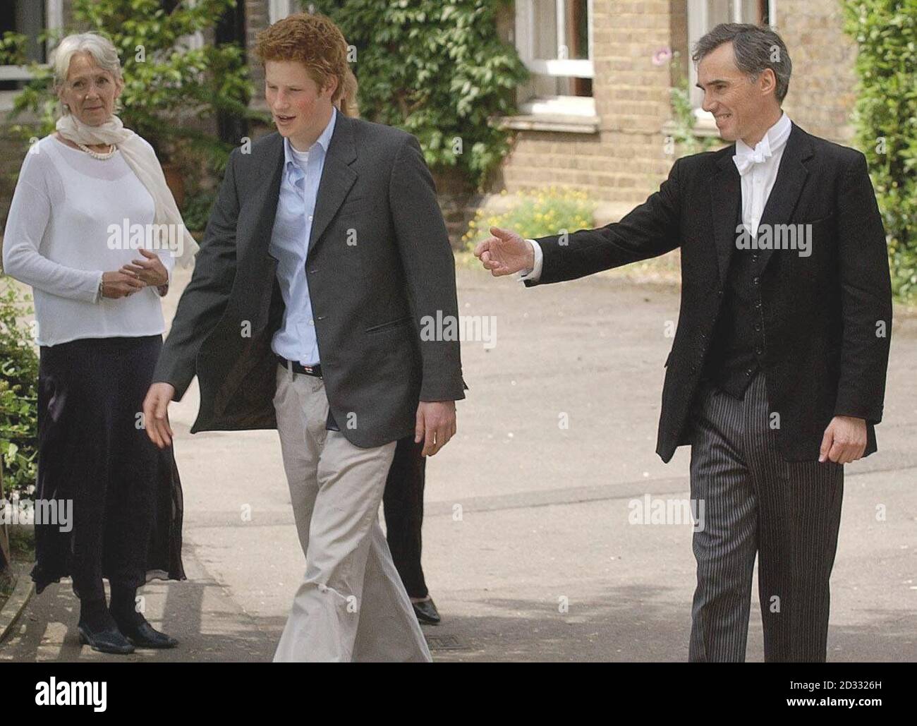 Prince Harry, the younger son of the Prince of Wales, says his farewells to his House Master Andrew Gailey as he leaves Eton College on his last day at the top public school where he has been a pupil for five years. * Like his older brother William, Harry has spent his Eton schooldays boarding at Manor House, on the site of the lodgings of probably the most famous Old Etonian of them all, victor of Waterloo, the Duke of Wellington. It has been announced that Prince Harry is to apply for entry to the Royal Military Acdemy at Sandhurst. 14/06/03 : House Master Andrew Gailey saying farewell to Stock Photo