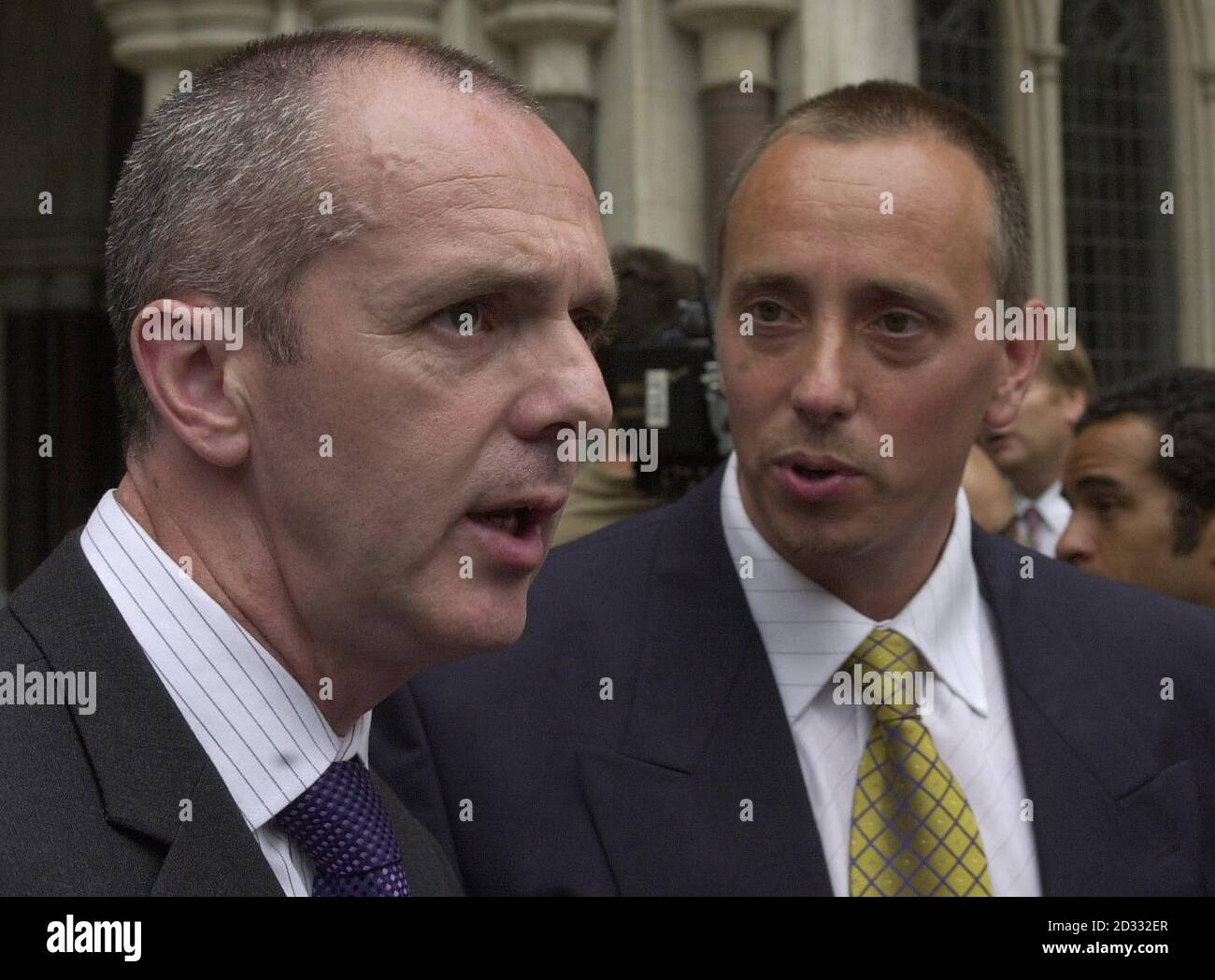 Gary Mills, left, and Anthony Poole leave the High Court in London  after hearing that their convictions for murder had been quashed by the Court of Appeal. The pair were jailed for life in 1990 at Bristol Crown Court after a fatal stabbing during a fight at a flat in Gloucester. S   Stock Photo