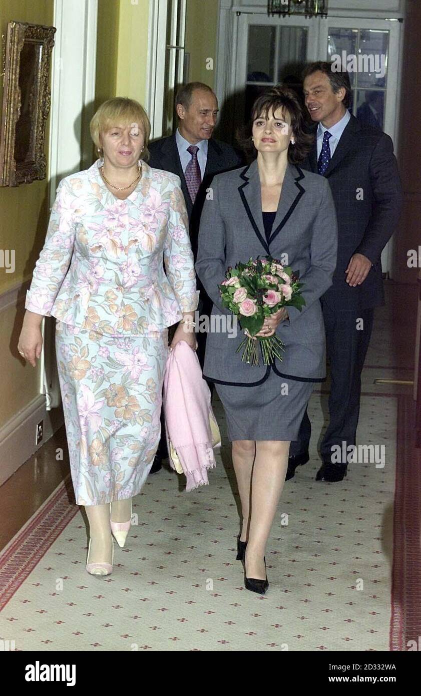 Cherie Blair (r) and Lyudmila Putina (l ) walk down the corridor followed by their husbands Prime Minister Tony Blair (back r) and Russian President Vladimir Putin (back l )  *   at No. 10 Downing Street. Putin is on a four-day state visit to Britain the first by a Russian leader for more than 100 years.  Stock Photo