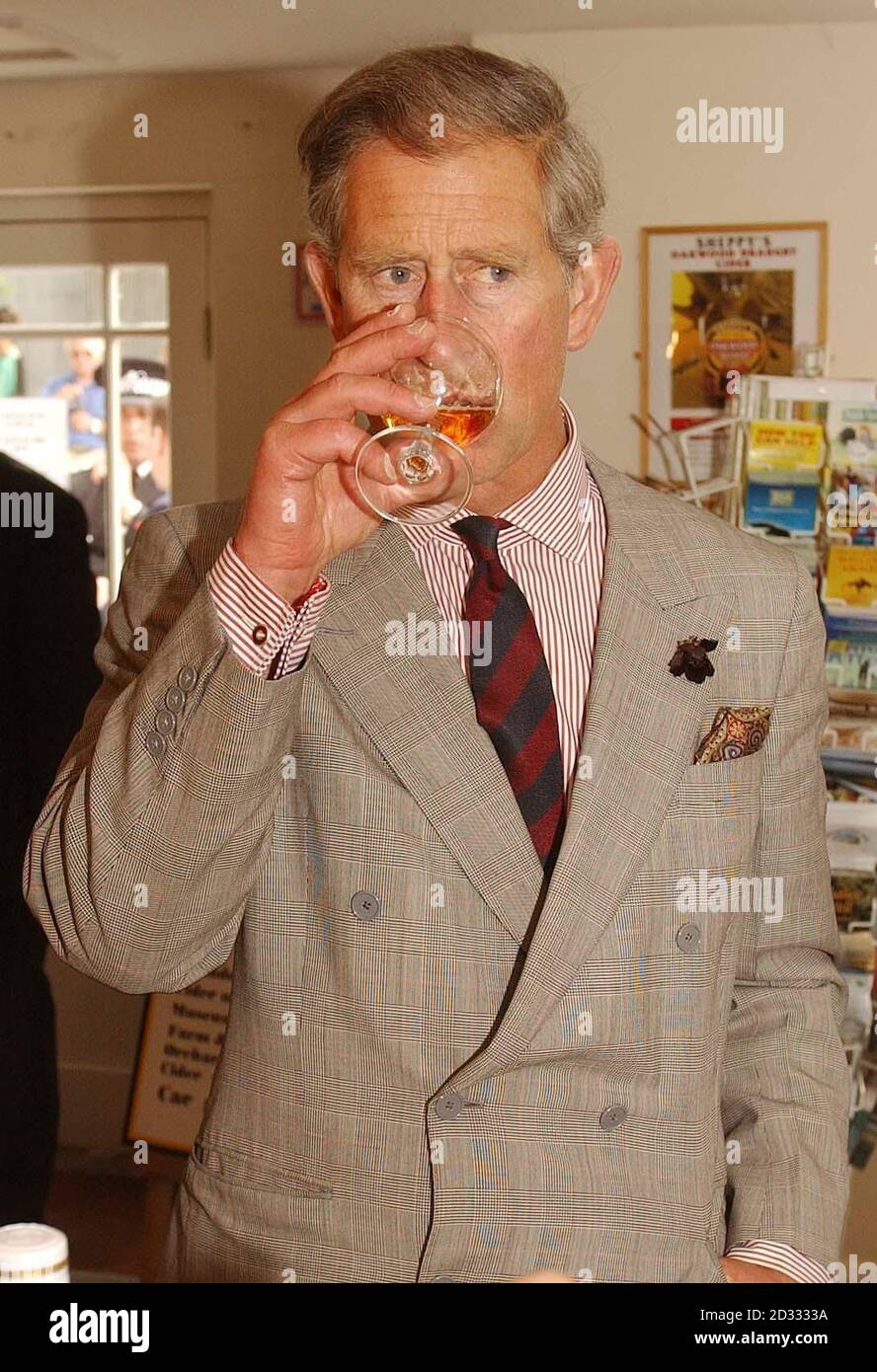 The Prince of Wales tastes some of the cider made by Sheppy's Cider Farm Centre, outside Taunton Somerset. He was also shown around a rural life museum, housing antique agricultural and cider making tools.  Stock Photo