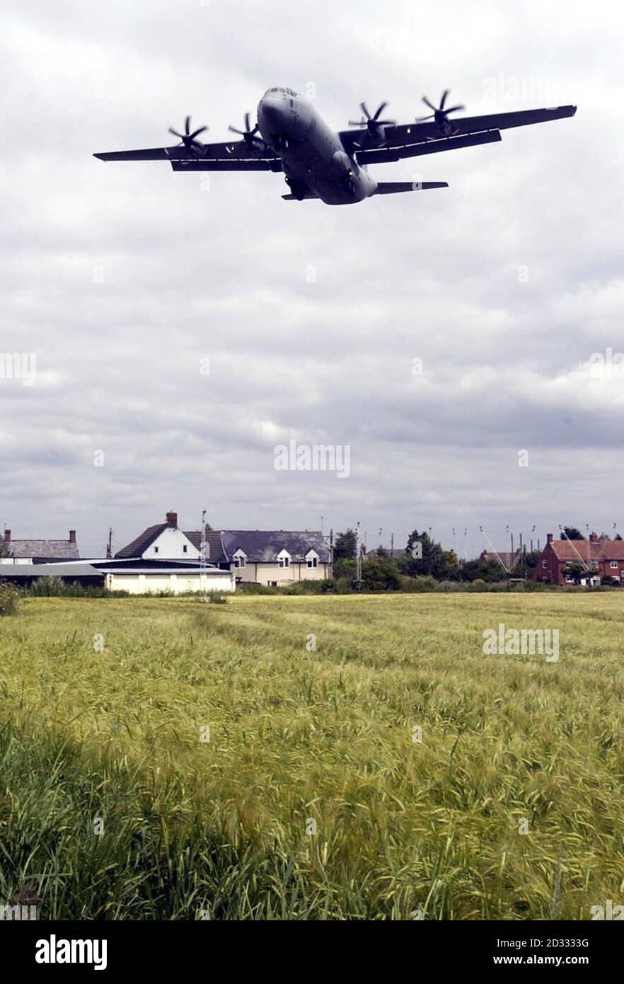 A Hercules flies over local houses, as it lands at RAF Lyneham, in Wiltshire. News of the closure of RAF Lyneham provoked fury from a Tory MP who accused the Prime Minister of lying in Parliament about the future of the base. *  James Gray, Conservative MP for north Wiltshire, said the closure of Lyneham would have a devastating impact on the local community and could threaten the livelihoods of up to 10,000 people in the area. 'It is a disgraceful announcement, disgracefully handled and it is a huge disappointment for the people of Lyneham,' said Mr Gray. Stock Photo