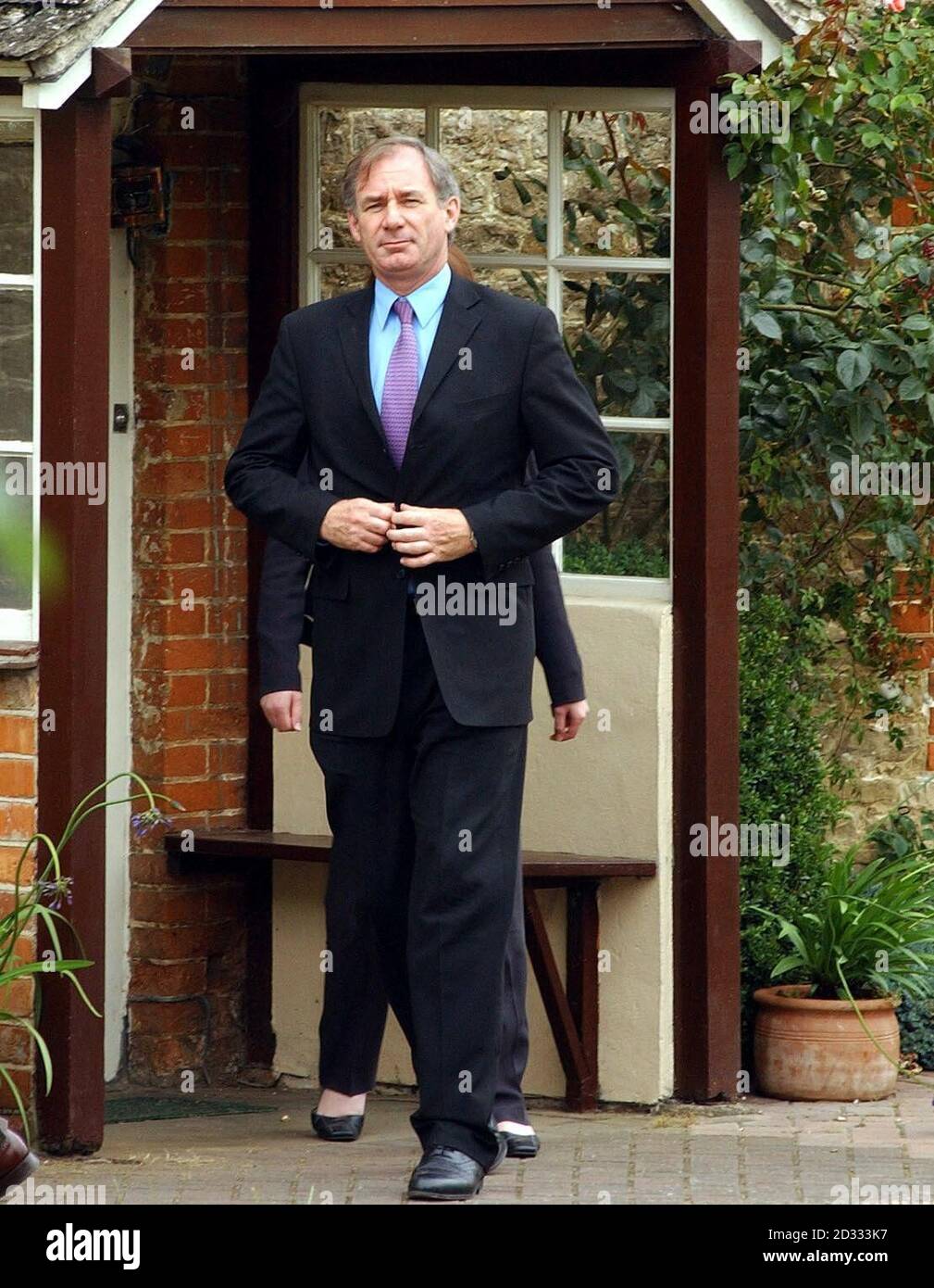 Defence Secretary Geoff Hoon leaves, after visiting Janice Kelly, the widow of scientist Dr David Kelly.  He spent just over an hour and a quarter at her home in Abingdon near Oxford. Stock Photo