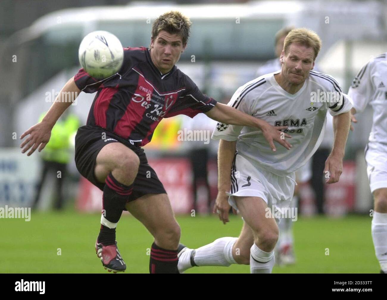 Dublin Bohemians player, Robbie Doyle (L) chases the ball with Rosenborg BK player, Fredrik Wisnes, in tonight's UEFA Champions League Qualifier at the Bohemians Dalymount Park, in Dublin, Republic of Ireland. Stock Photo