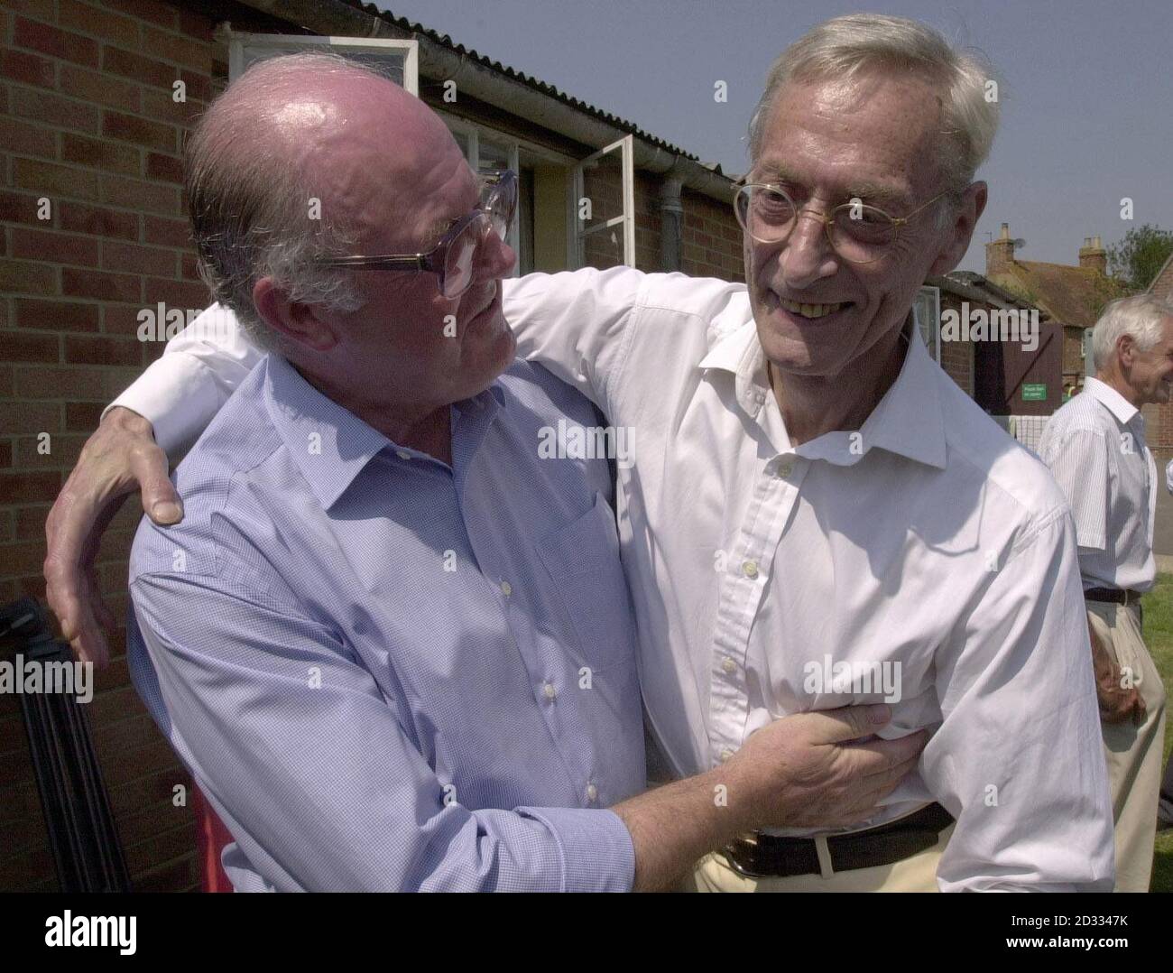 Great Train Robber Bruce Reynolds (right) meets former police officer John Woolley at Oakley Village Hall, Buckinghamshire, during a village fete.  Mr Woolley discovered the robbers had been using nearby Leatherslade Farm as a hideout during the planning and immediate aftermath of the robbery in 1963.   Stock Photo