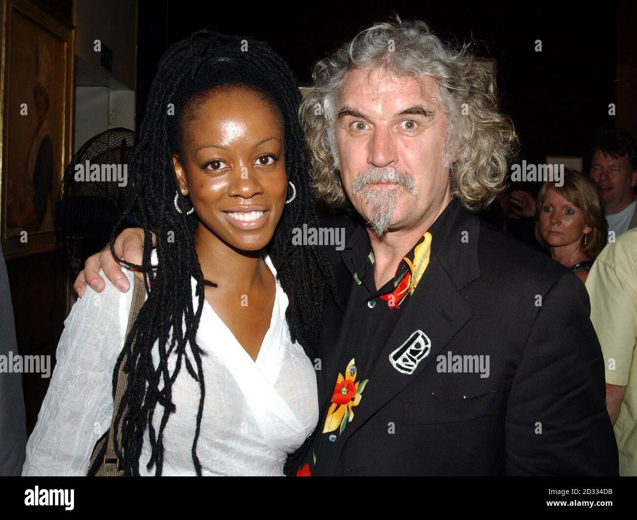Singer Peppercorn and comedian Billy Connolly at the Warner Village cinema, Leicester Square, London, for the premiere of Billy Connolly's new film 'The Man Who Sued God'.   Stock Photo