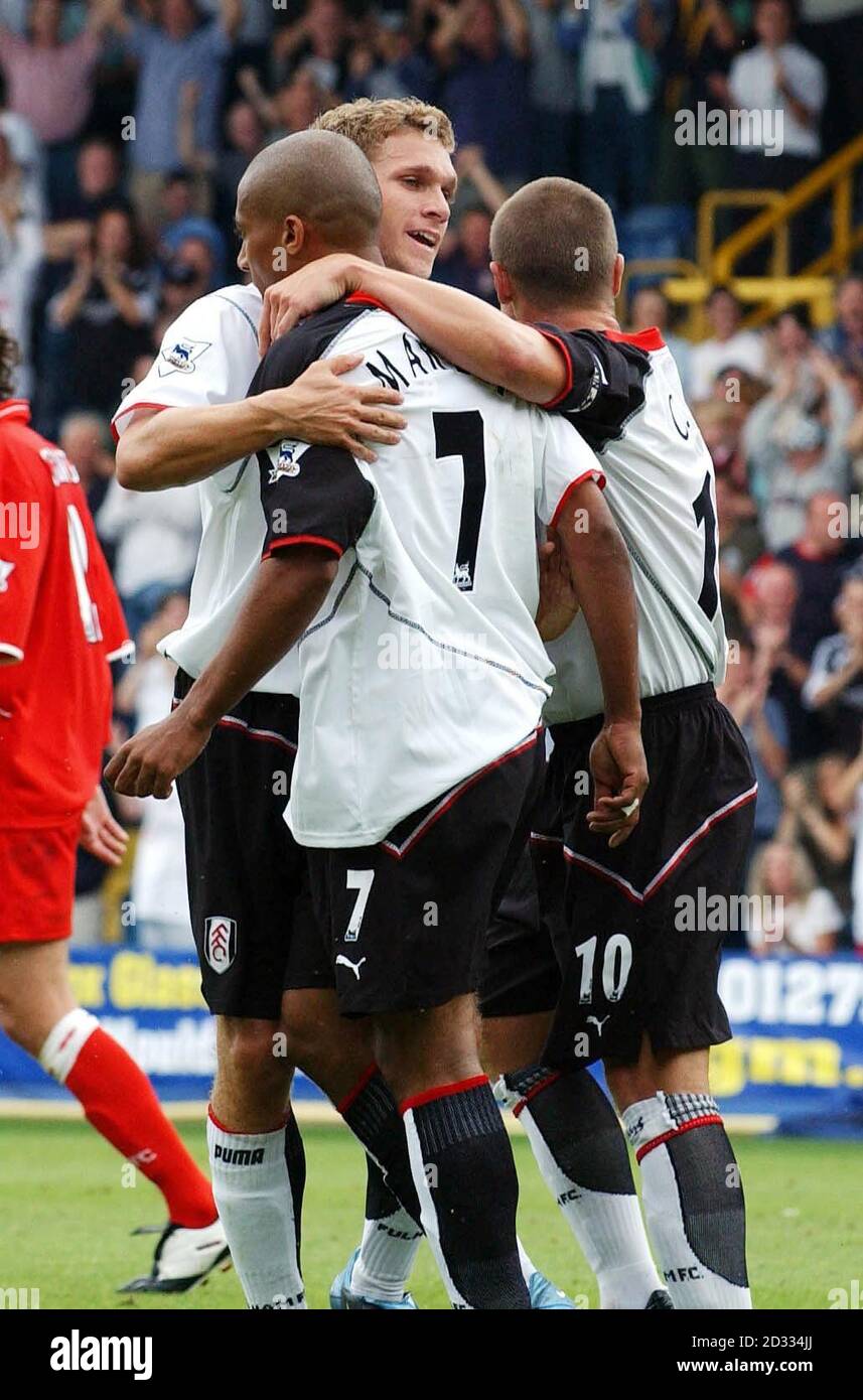 Fulham's Moritz Volz (left) embraces team-mate Steve Martlet after he scores against Middlesbrough during the FA Barclaycard Premiership match at Loftus Road, London. THIS PICTURE CAN ONLY BE USED WITHIN THE CONTEXT OF AN EDITORIAL FEATURE. NO WEBSITE/INTERNET USE UNLESS SITE IS REGISTERED WITH FOOTBALL ASSOCIATION PREMIER LEAGUE. Stock Photo