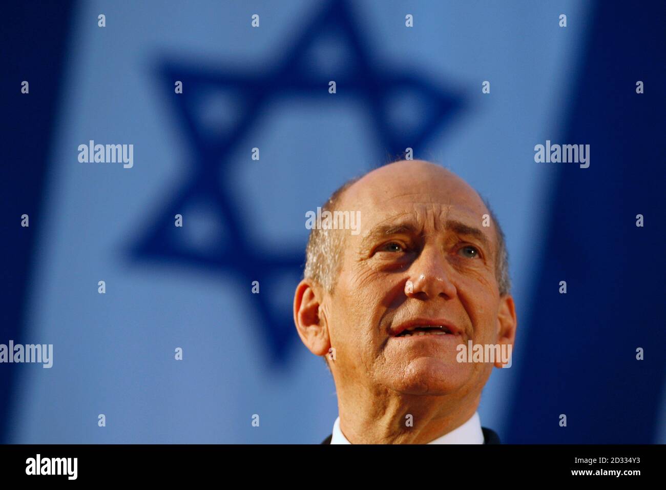Israel's Prime Minister Ehud Olmert gives a speech during a graduation ceremony of the National Security College in Jerusalem July, 2008. Olmert said the Jewish state had resumed indirect talks with Syria in Turkey on Tuesday and called on Damascus to break with Iran in favour of a broader peace. REUTERS/Baz Ratner (JERUSALEM) Stock Photo
