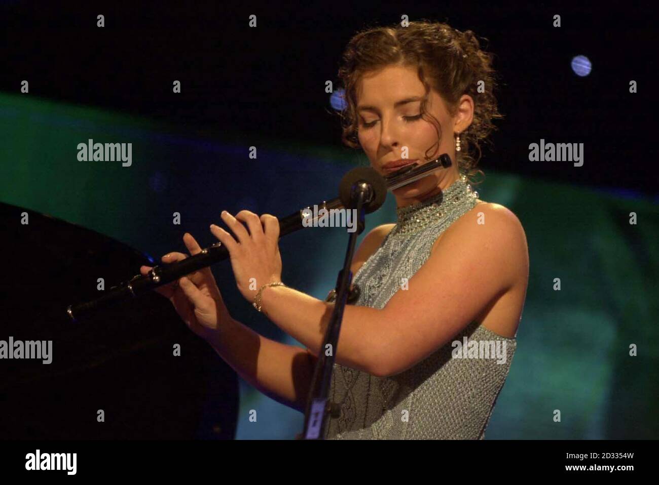 Blathnaid Nuallain, representing the Fodhla - the Irish speaking areas of Ireland - plays the flute in the televised final of the 2003 Rose of Tralee International Festival, a personality contest for young women of Irish heritage, in Tralee, Co Kerry. *  As well as becoming an ambassador for the festival and for Ireland, the winning Rose will receive a selection of gifts and prizes including 5,000 euros in cash.  Stock Photo