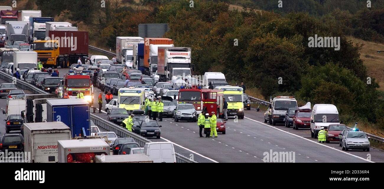 Emergency services crews attend the scene of a crash involving 12 vehicles on the northbound carriageway of the M5 motorway near Bristol. Up to a dozen people were injured in the accident, which happened between junctions 20 and 19 of the motorway shortly after 1pm. The cause of the crash was not yet known, but a police spokesman said there were reports of a heavy downpour at around the time of the incident. Stock Photo