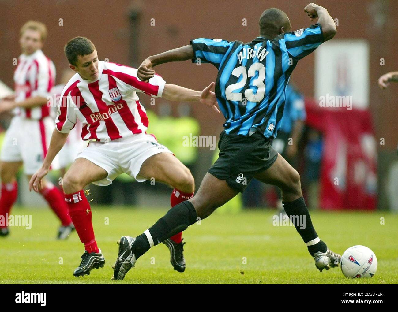 Nottingham Forest's Wes Morgan (right) breaks away from Lewis Neal of Stoke City, during their Nationwide Division One match at the Britannia Stadium, Stoke. Final score: Stoke City 2, Nottingham Forest 1.   THIS PICTURE CAN ONLY BE USED WITHIN THE CONTEXT OF AN EDITORIAL FEATURE. NO UNOFFICIAL CLUB WEBSITE USE. Stock Photo