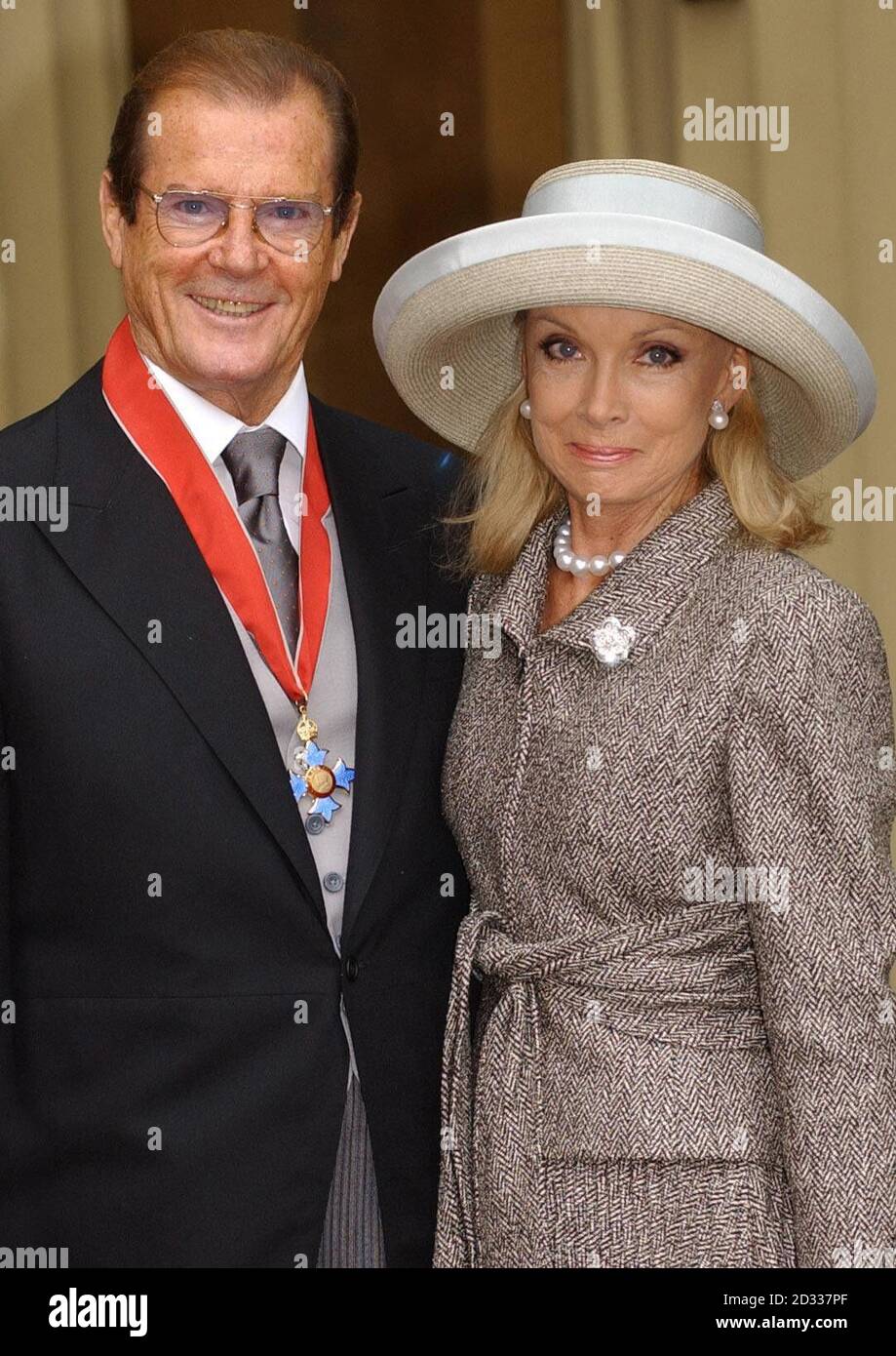 Sir Roger Moore and his wife Christina with his Knighthood at Buckingham Palace which he was awarded for charitable services especially UNICEF. Moments after receiving his knighthood from the Queen, the suave superstar said: 'I had the worst attack of stage fright in my life. When you realise the gravitas of the situation, it's slightly nerve-racking. It was like a costume drama and I was Sir Ivanhoe - a part I have played, incidentally.' Sir Roger, 75, who was knighted for his tireless charity work, disclosed that the Queen had recognised his dilemma.  Stock Photo